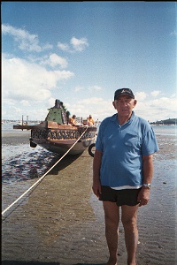 Maori caretaker and the tribal canoe on 