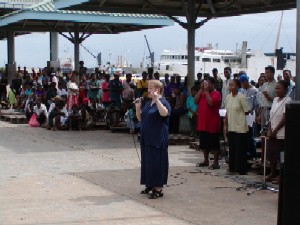 Chris Cunnington addresses a crowd in the city Market