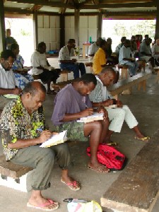 Pastors take notes during a day session