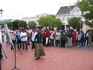 a local singer captivates the crowd in Catherdral Square