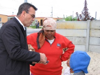 Dr. Mark Setch explains the Gospel to a woman on street in West Bank