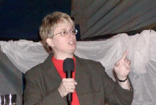 Julie preaches in the tent