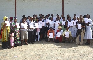 Some of those trained in evangelism show their certificates
