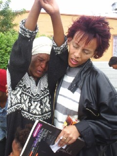 Weeping woman comforted on street