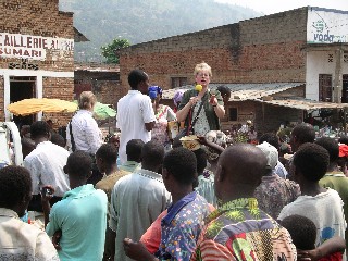 Julie preaches in the market.