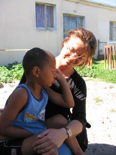 Jenni comforts one of the children
